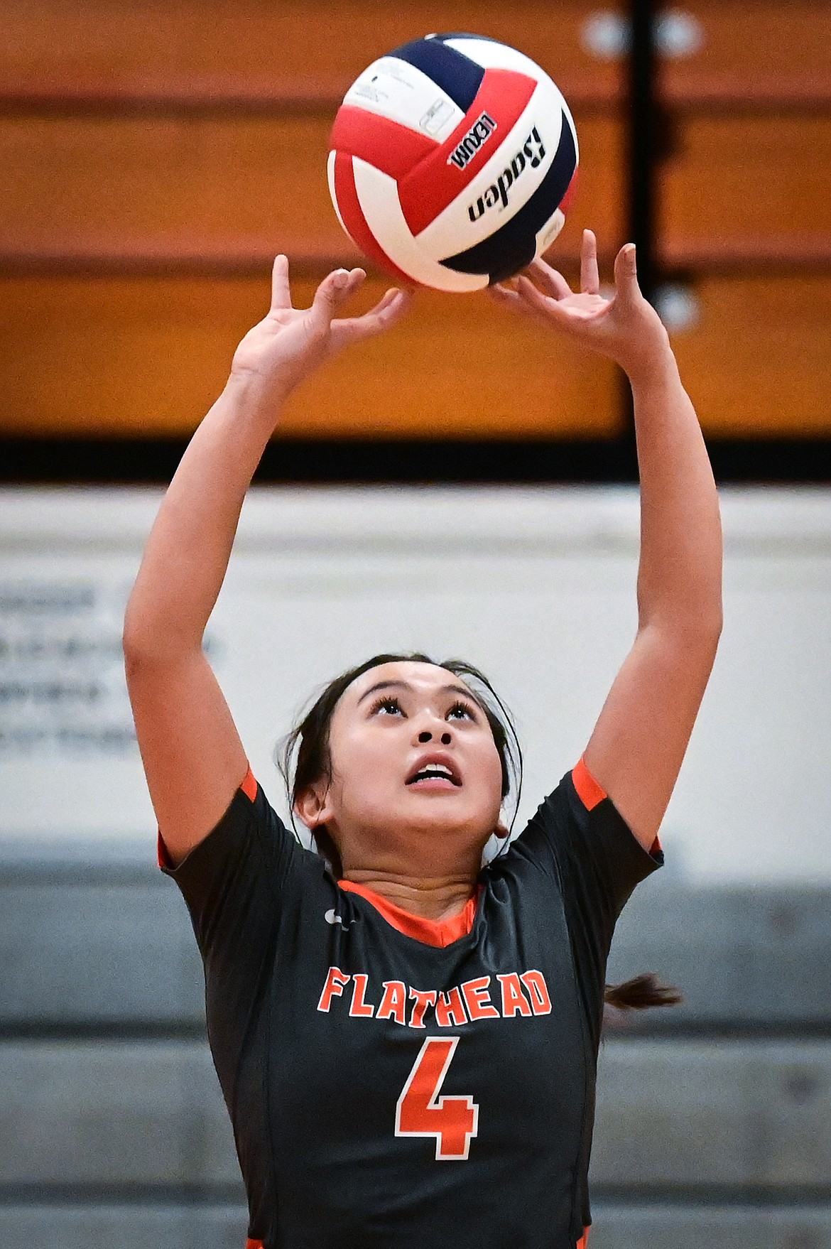 Flathead's Kylie Munsinger (4) sets for a teammate against Missoula Hellgate at Flathead High School on Thursday, Sept. 23. (Casey Kreider/Daily Inter Lake)