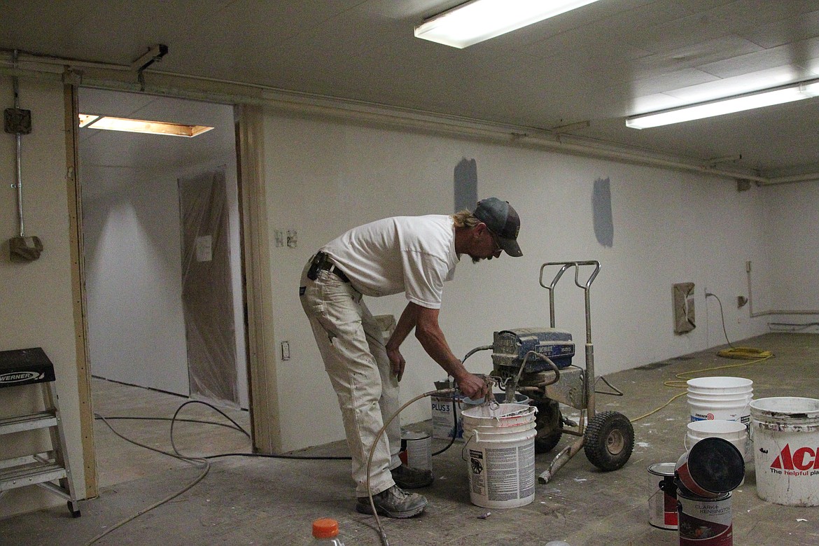 Josh Moore, painter with Morris Services, prepares to paint in the basement of the Lincoln County Annex. County election staff are planning to move into the room and adjoining hallway by the November municipal election. (Will Langhorne/The Western News)