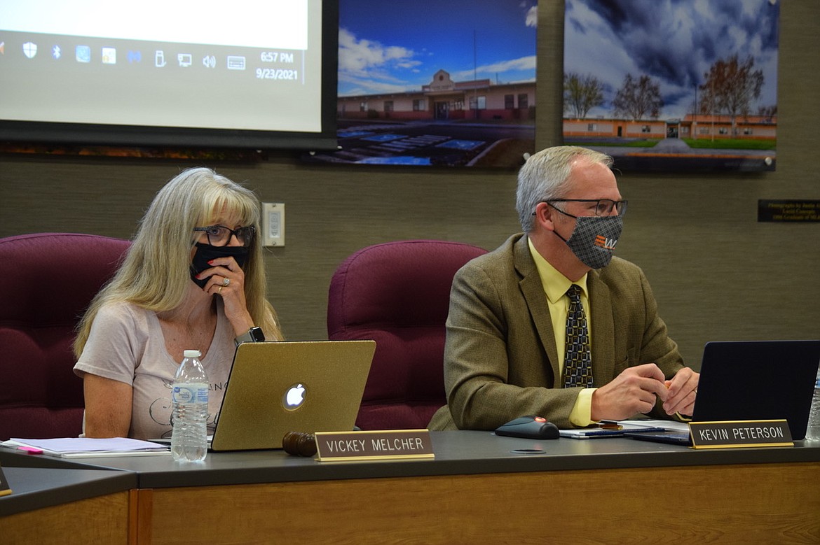 Moses Lake School Board President Vickey Melcher and Director of Special Services Kevin Peterson sit at Thursday night’s school board meeting.