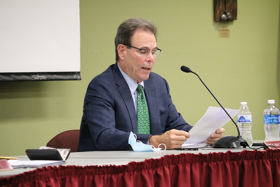 Former college President Rick MacLennan addresses the board regarding COVID-19 at the board meeting at North Idaho College on Wednesday night, the same meeting in which his contract was terminated at the end of day Thursday. HANNAH NEFF/Press
