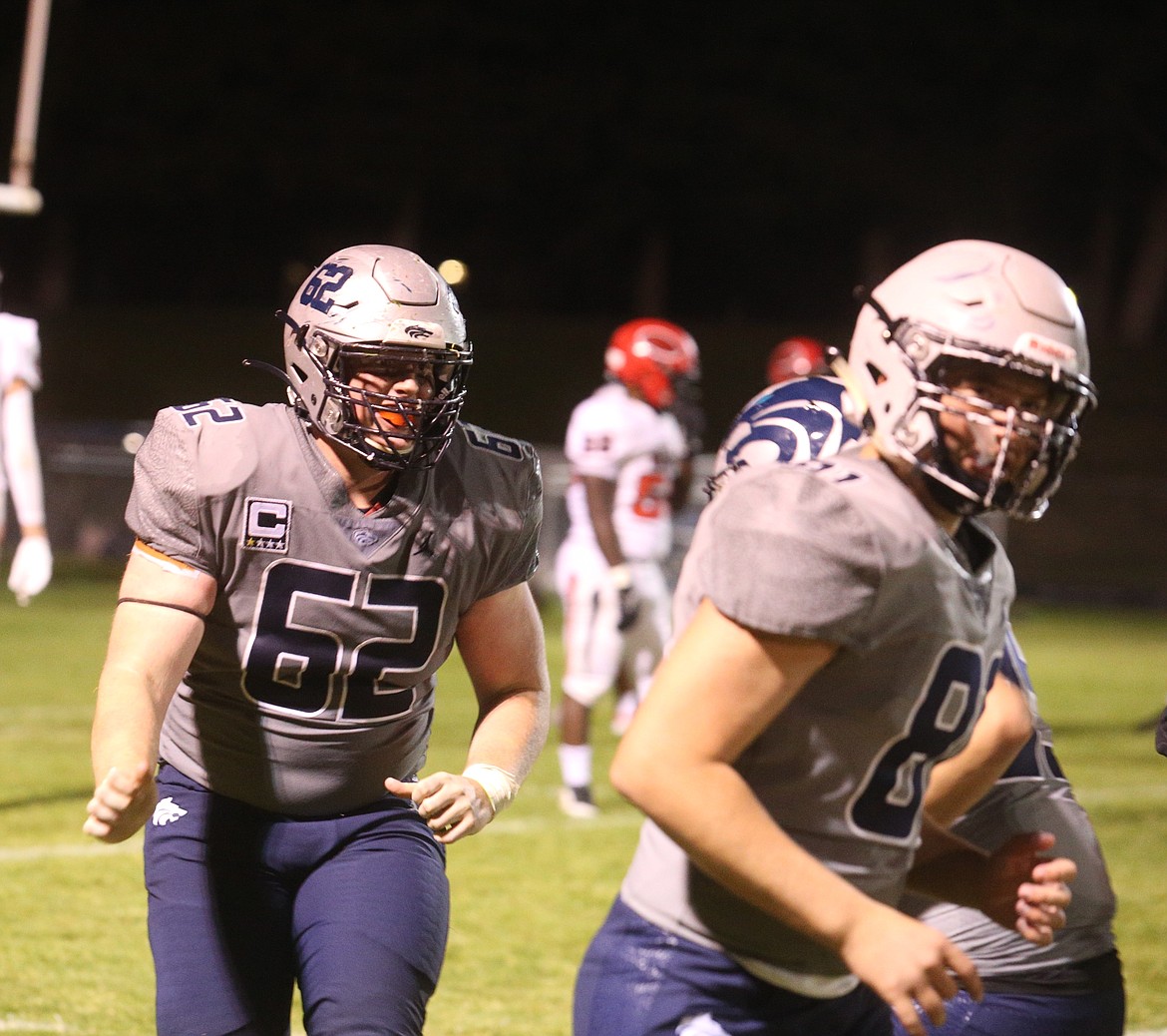 JASON ELLIOTT/Press
Lake City High senior defensive tackle Xavier Johnson returns to the sideline after intercepting a screen pass in the third quarter of the Timberwolves 26-12 win over the Moscow Bears on Friday at Lake City High.