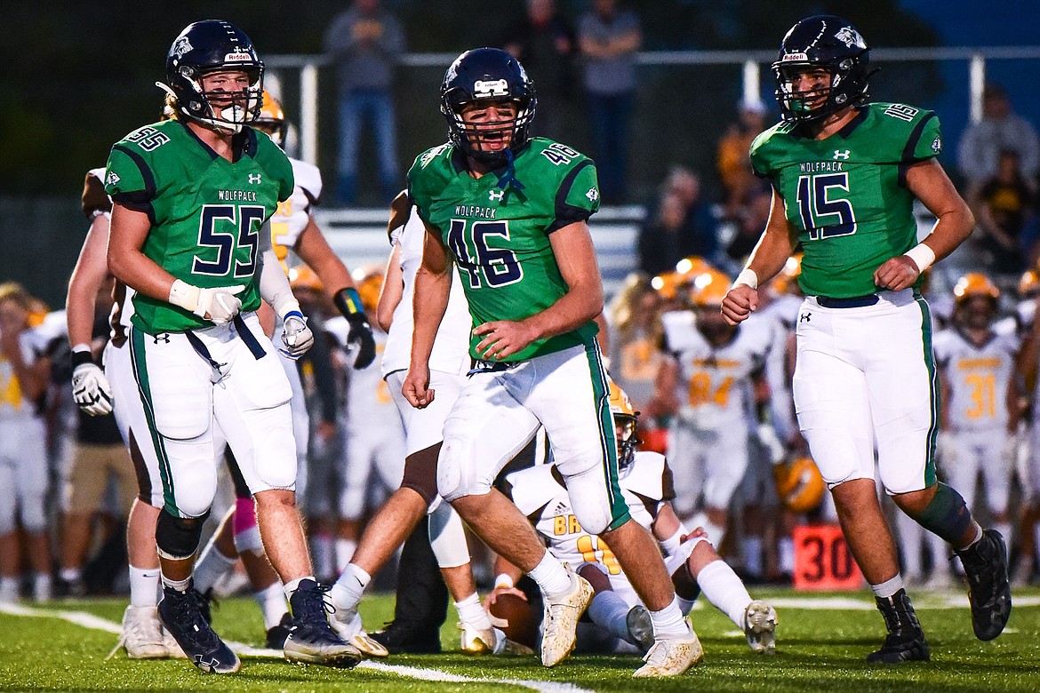 Glacier linebacker Royce Conklin (46) celebrates after a sack of Helena Capital quarterback Joey Michelotti (11) in the second quarter at Legends Stadium on Friday. (Casey Kreider/Daily Inter Lake)