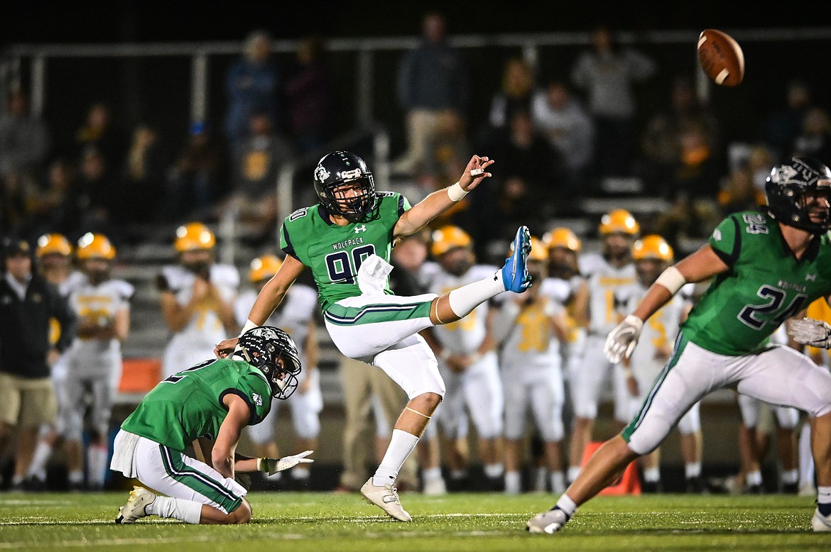 Glacier kicker Patrick Rohrbach (90) boots an extra point against Helena Capital at Legends Stadium on Friday, Sept. 24. (Casey Kreider/Daily Inter Lake)