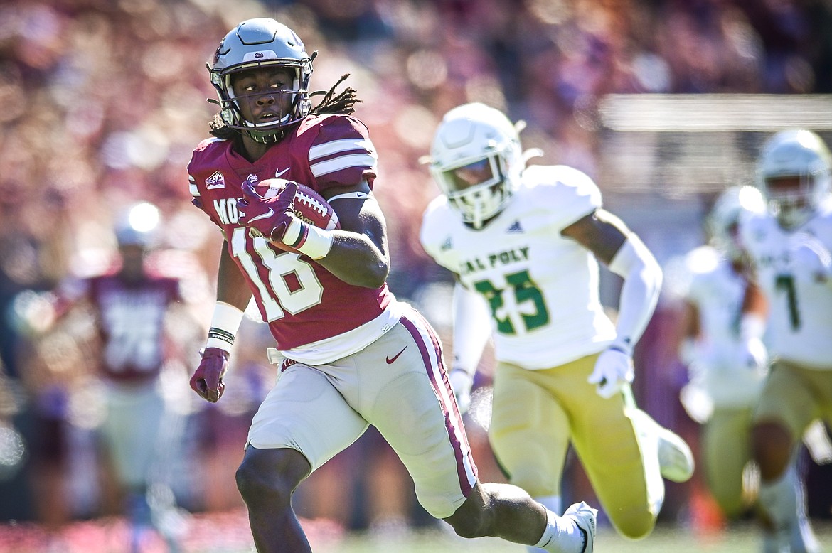 Montana wide receiver Samuel Akem (18) takes a 65-yard touchdown reception to the end zone in the first quarter against Cal Poly at Washington-Grizzly Stadium on Saturday, Sept. 25. (Casey Kreider/Daily Inter Lake)