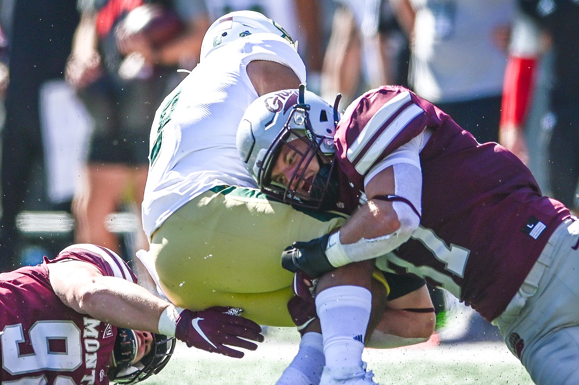 Montana linebacker Jace Lewis (37) stops Cal Poly running back Shakobe Parker (8) in the first quarter at Washington-Grizzly Stadium on Saturday, Sept. 25. (Casey Kreider/Daily Inter Lake)