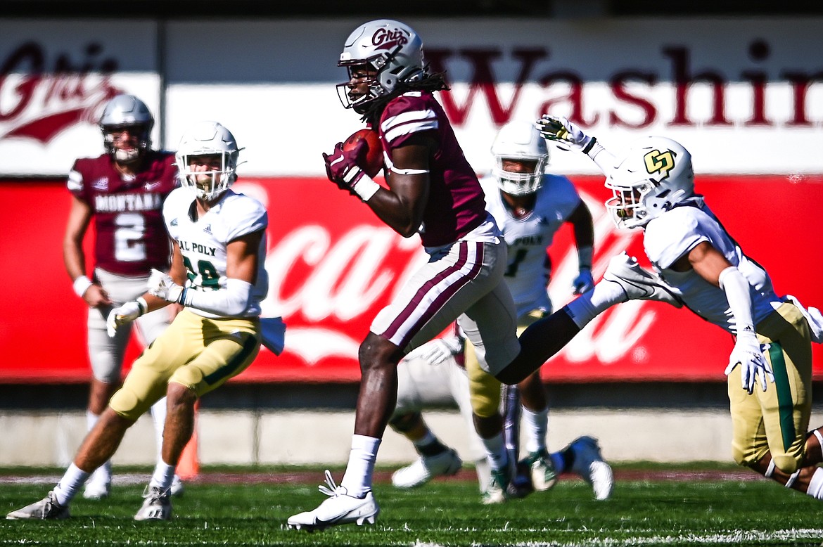 Montana wide receiver Samuel Akem (18) catches a 19-yard reception in the third quarter against Cal Poly at Washington-Grizzly Stadium on Saturday, Sept. 25. (Casey Kreider/Daily Inter Lake)