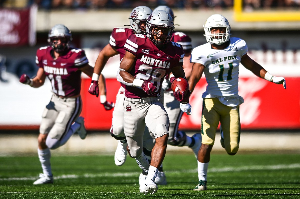 Montana running back Isiah Childs (28) looks for running room in the third quarter against Cal Poly at Washington-Grizzly Stadium on Saturday, Sept. 25. (Casey Kreider/Daily Inter Lake)