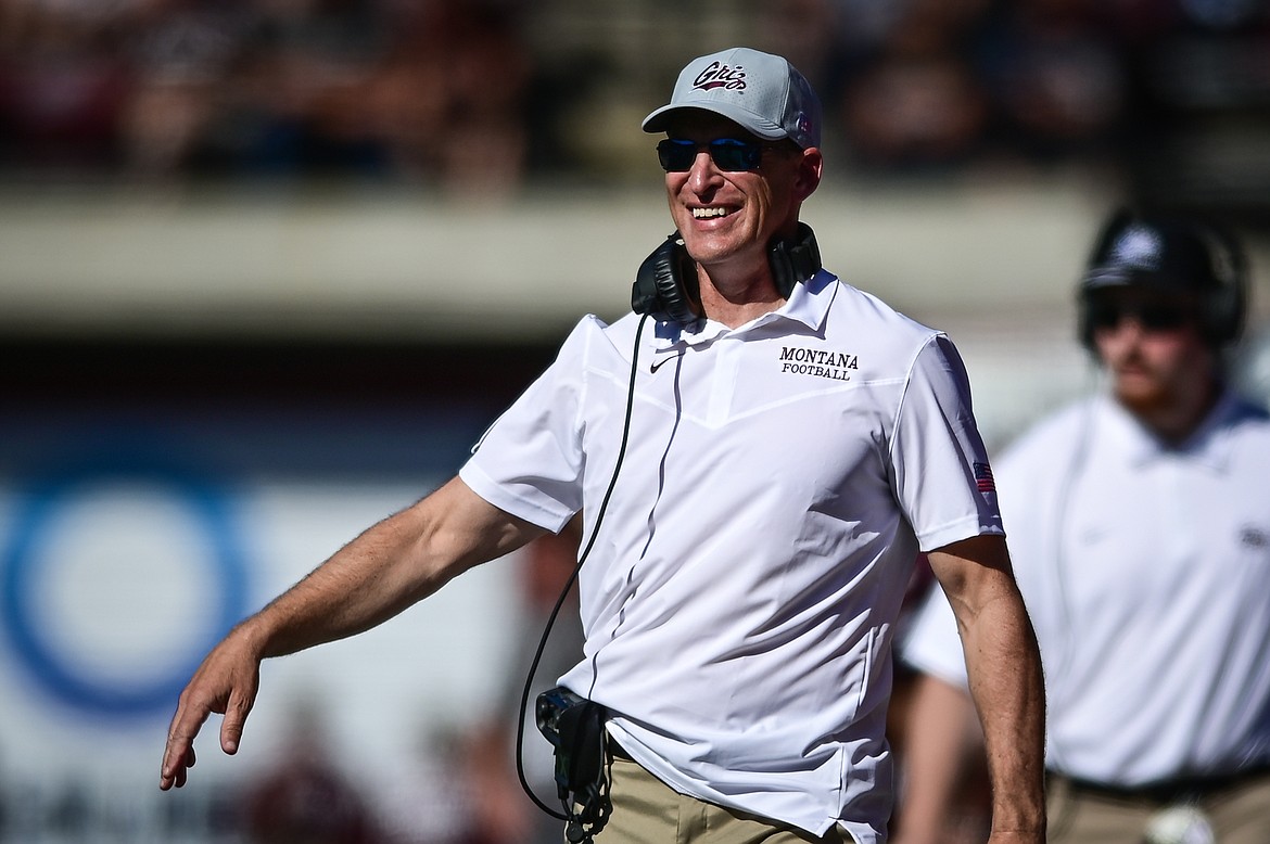 Montana head coach Bobby Hauck smiles as his special teams unit comes off the field in the third quarter against Cal Poly at Washington-Grizzly Stadium on Saturday, Sept. 25. (Casey Kreider/Daily Inter Lake)