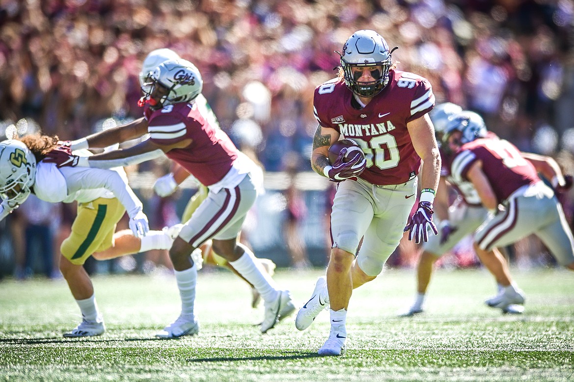 Montana defensive end Justin Belknap (90) returns an interception 24-yards for a touchdown in the first quarter against Cal Poly at Washington-Grizzly Stadium on Saturday, Sept. 25. (Casey Kreider/Daily Inter Lake)