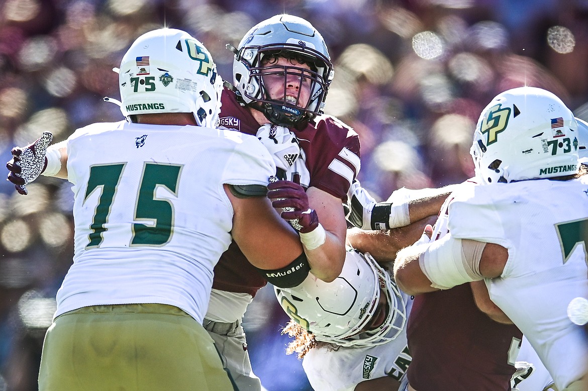 Montana defensive lineman Henry Nuce (96) from Glacier High School battles on the line in the fourth quarter against Cal Poly at Washington-Grizzly Stadium on Saturday, Sept. 25. (Casey Kreider/Daily Inter Lake)