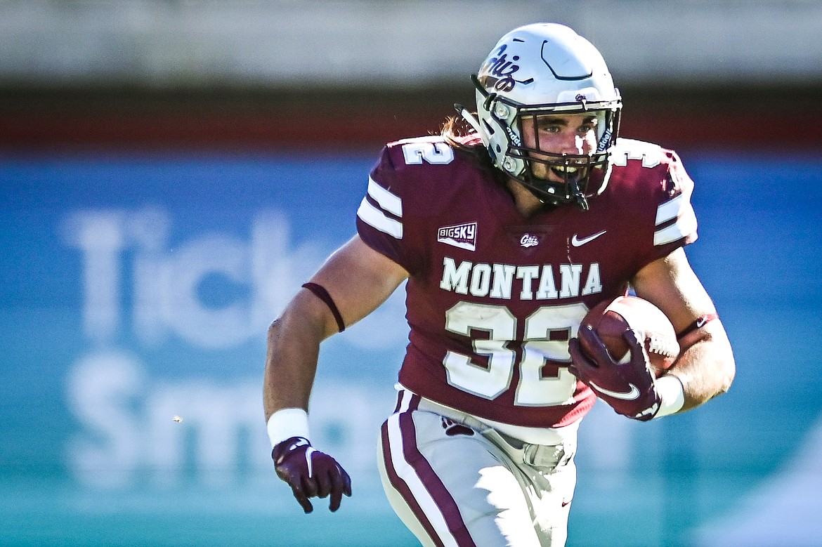 Montana running back Drew Turner (32) from Glacier High School looks upfield after catching a screen pass in the fourth quarter against Cal Poly at Washington-Grizzly Stadium on Saturday, Sept. 25. (Casey Kreider/Daily Inter Lake)