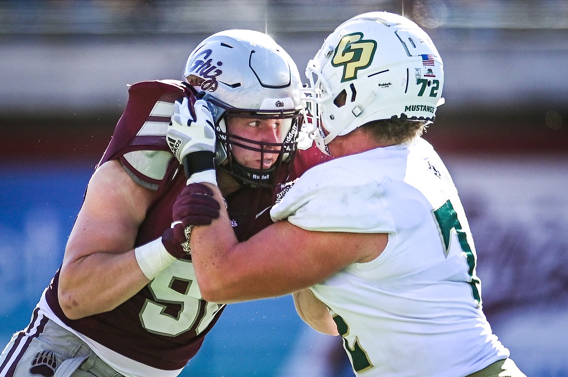 Montana defensive lineman Henry Nuce (96) from Glacier High School battles on the line in the fourth quarter against Cal Poly at Washington-Grizzly Stadium on Saturday, Sept. 25. (Casey Kreider/Daily Inter Lake)