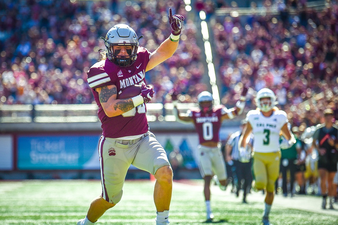 Montana defensive end Justin Belknap (90) returns an interception 24-yards for a touchdown in the first quarter against Cal Poly at Washington-Grizzly Stadium on Saturday, Sept. 25. (Casey Kreider/Daily Inter Lake)