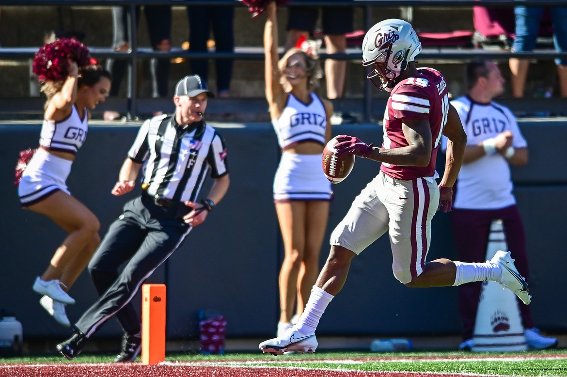 Montana kick returner Malik Flowers (19) scores on a 95-yard kickoff return for a touchdown in the third quarter against Cal Poly at Washington-Grizzly Stadium on Saturday, Sept. 25. (Casey Kreider/Daily Inter Lake)