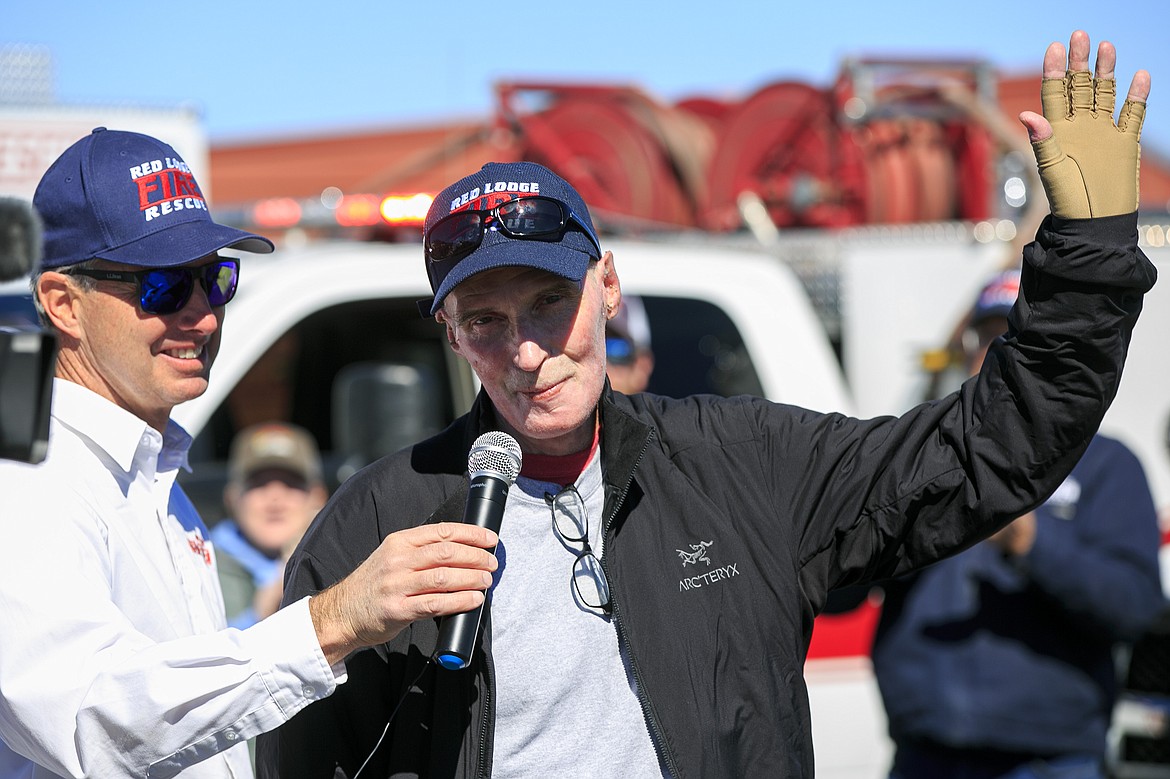 Red Lodge firefighter Dan Steffensen, 65, gives a brief speech while being welcomed home Tuesday, Sept. 21, 2021, at the Red Lodge Airport in Red Lodge, Mont. Steffensen was flown to the University of Utah Burn Center in July after he was severely burned while fighting a fire north of Joliet, Mont. He underwent multiple surgeries, including skin grafts. (Ryan Berry/The Billings Gazette via AP)