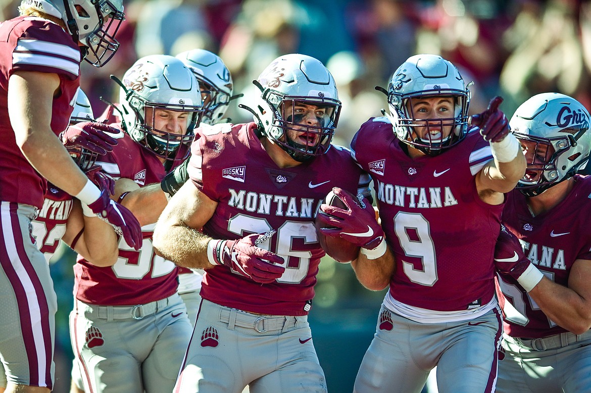 Montana linebacker Levi Janacaro (36) celebrates with David Koppang (9) and teammates after Janacaro's punt block and ensuing touchdown in the third quarter against Cal Poly at Washington-Grizzly Stadium on Saturday, Sept. 25. (Casey Kreider/Daily Inter Lake)