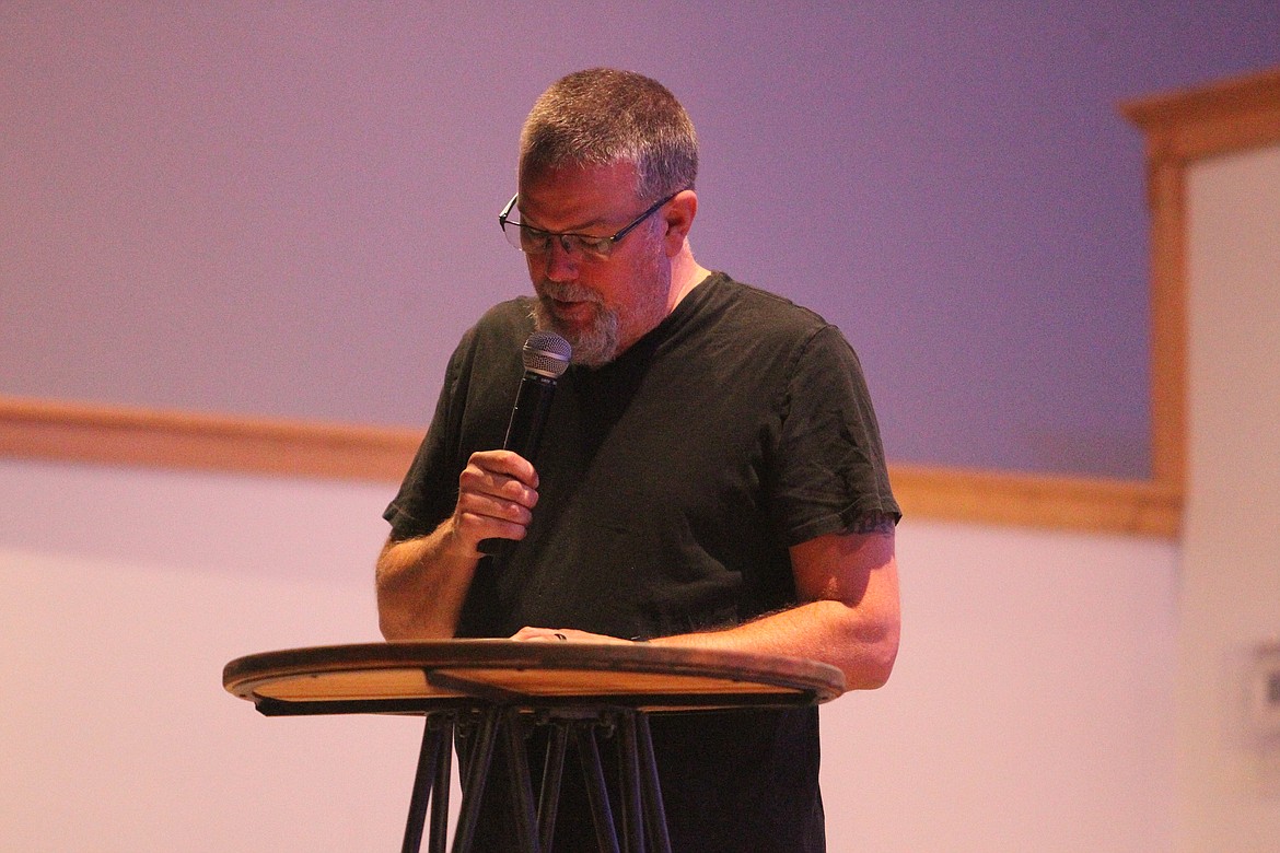 Eric Myers, pastor at Troy Christian Fellowship, speaks before community members gathered to pray for Ben Fisher, a Lincoln County Sheriff's Office deputy hospitalized with COVID-19, on Sept. 25. (Will Langhorne/The Western News)