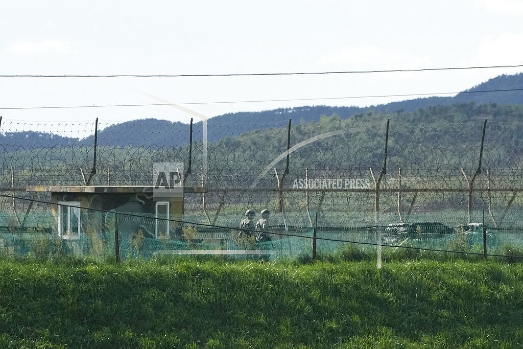 South Korean army soldiers patrol along the barbed-wire fence in Paju, South Korea, near the border with North Korea, Sunday, Sept. 26, 2021. The powerful sister of North Korean leader Kim Jong Un said Saturday that her country will take steps to repair ties with South Korea, and may even discuss another summit between their leaders, if the South drops what she described as hostility and double standards. (AP Photo/Ahn Young-joon)