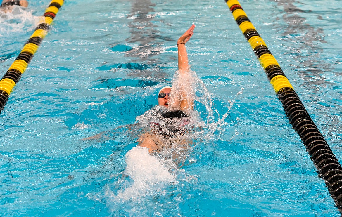 Freshman Ava de Leeuw swims the 100 backstroke on Saturday.