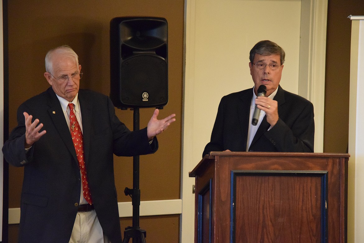 Columbia Basin Foundation co-founders Randy Dickinson, left, and Rick Honsowetz speak as part of the foundation’s 25th anniversary gala held at Pillar Rock Grill at Moses Lake Golf Club on Sunday.