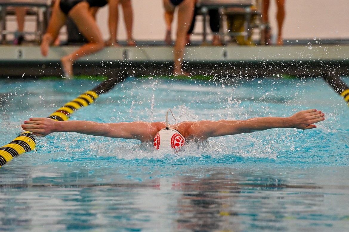 Senior Jack Grzincic competes in the 100 fly on Saturday.