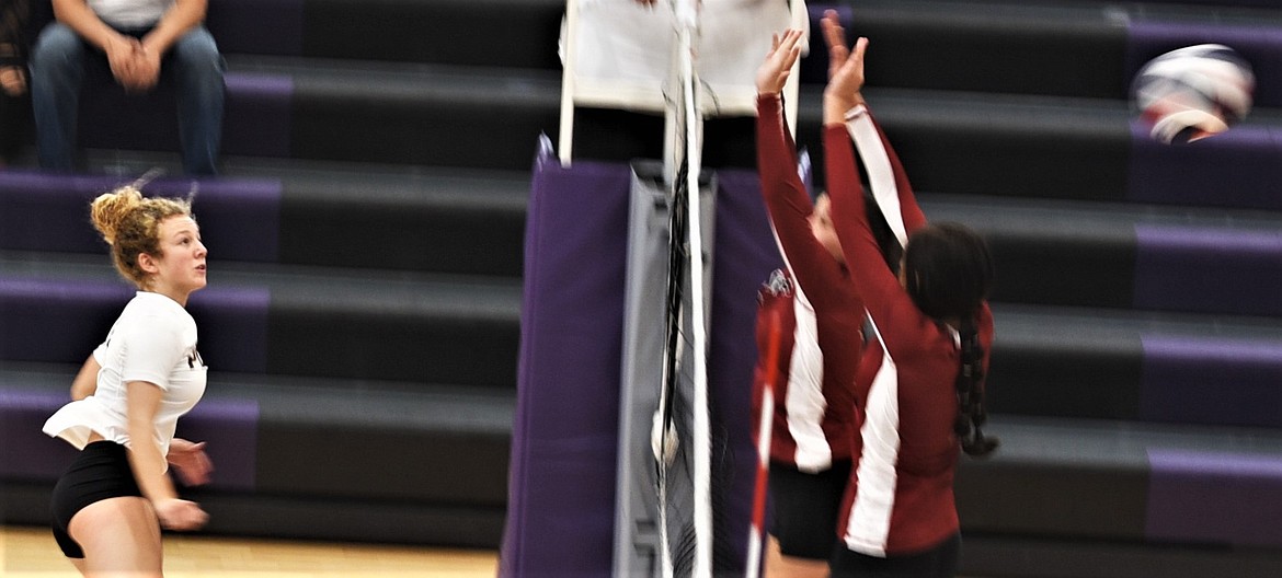 Polson's Camilla Foresti fires a shot past a pair of Browning defenders. (Scot Heisel/Lake County Leader)