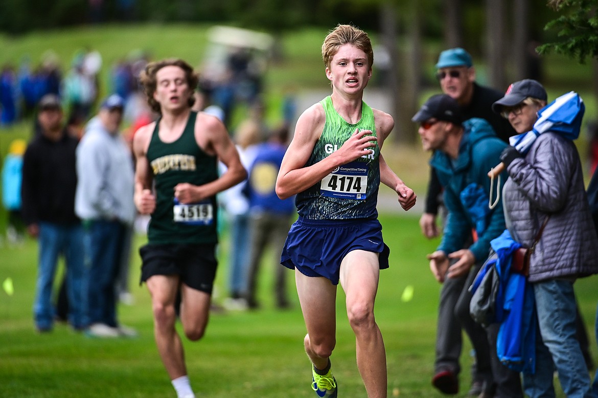 Glacier's Sam Ells and Whitefish's Deneb Linton race down the final straightaway before the finish at the Whitefish Invite on the South Course of Whitefish Lake Golf Club on Tuesday, Sept. 28. Glacier's Ells took home the win. (Casey Kreider/Daily Inter Lake)