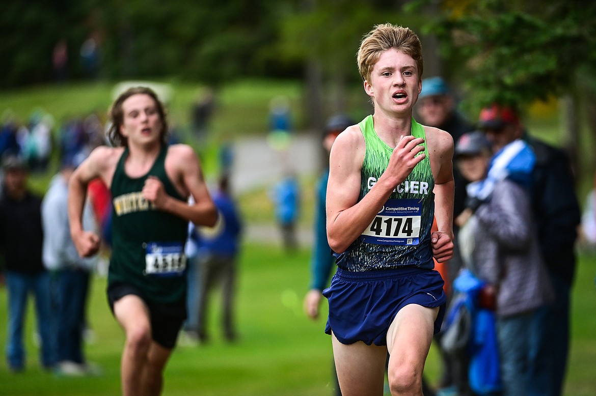 Glacier's Sam Ells and Whitefish's Deneb Linton race down the final straightaway before the finish at the Whitefish Invite on the South Course of Whitefish Lake Golf Club on Tuesday, Sept. 28. Glacier's Ells took home the win. (Casey Kreider/Daily Inter Lake)