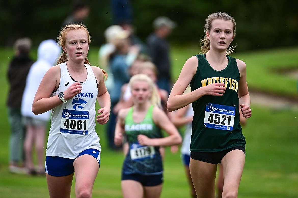 Whitefish's Paetra Cooke and Columbia Falls' Julia Martin compete at the Whitefish Invite on the South Course of Whitefish Lake Golf Club on Tuesday, Sept. 28. (Casey Kreider/Daily Inter Lake)