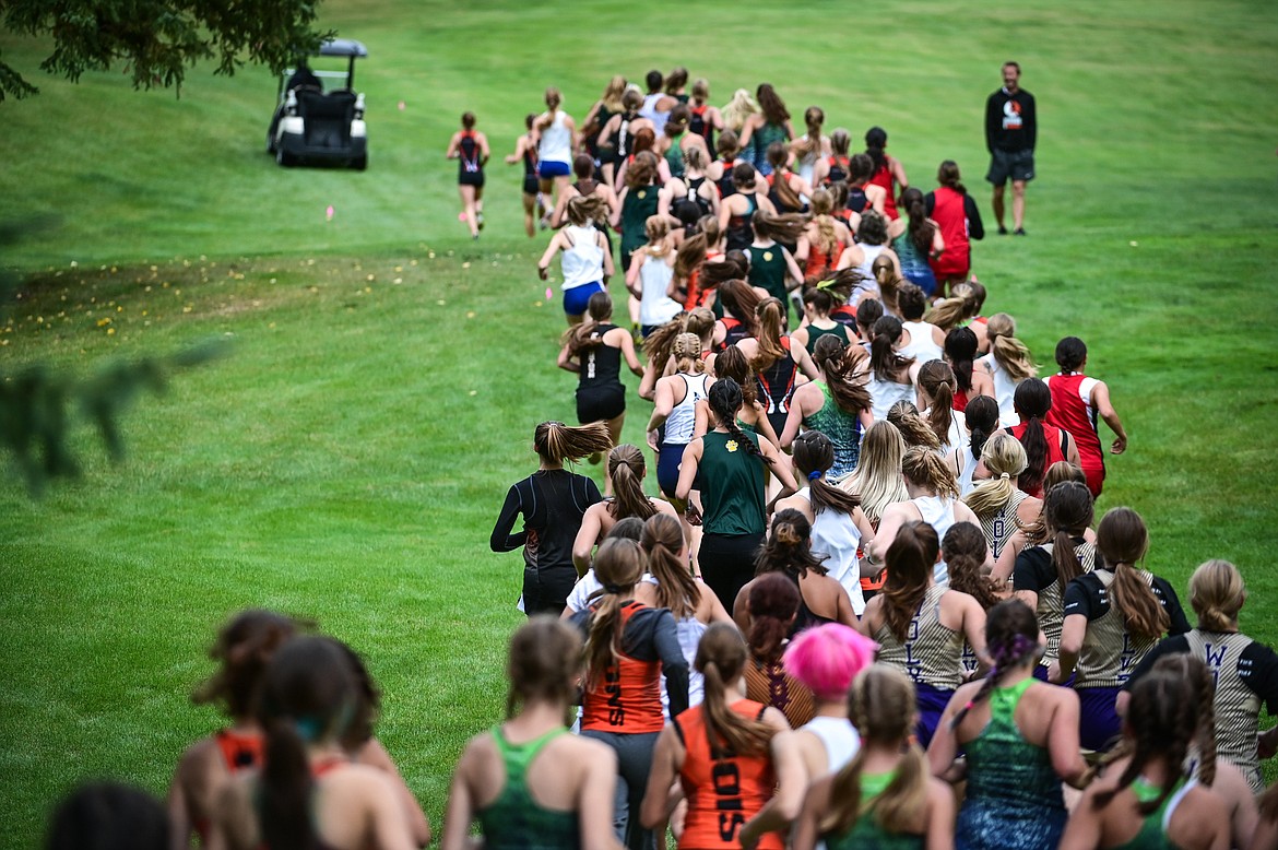 Girls race during the first lap of the Whitefish Invite on the South Course of Whitefish Lake Golf Club on Tuesday, Sept. 28. (Casey Kreider/Daily Inter Lake)