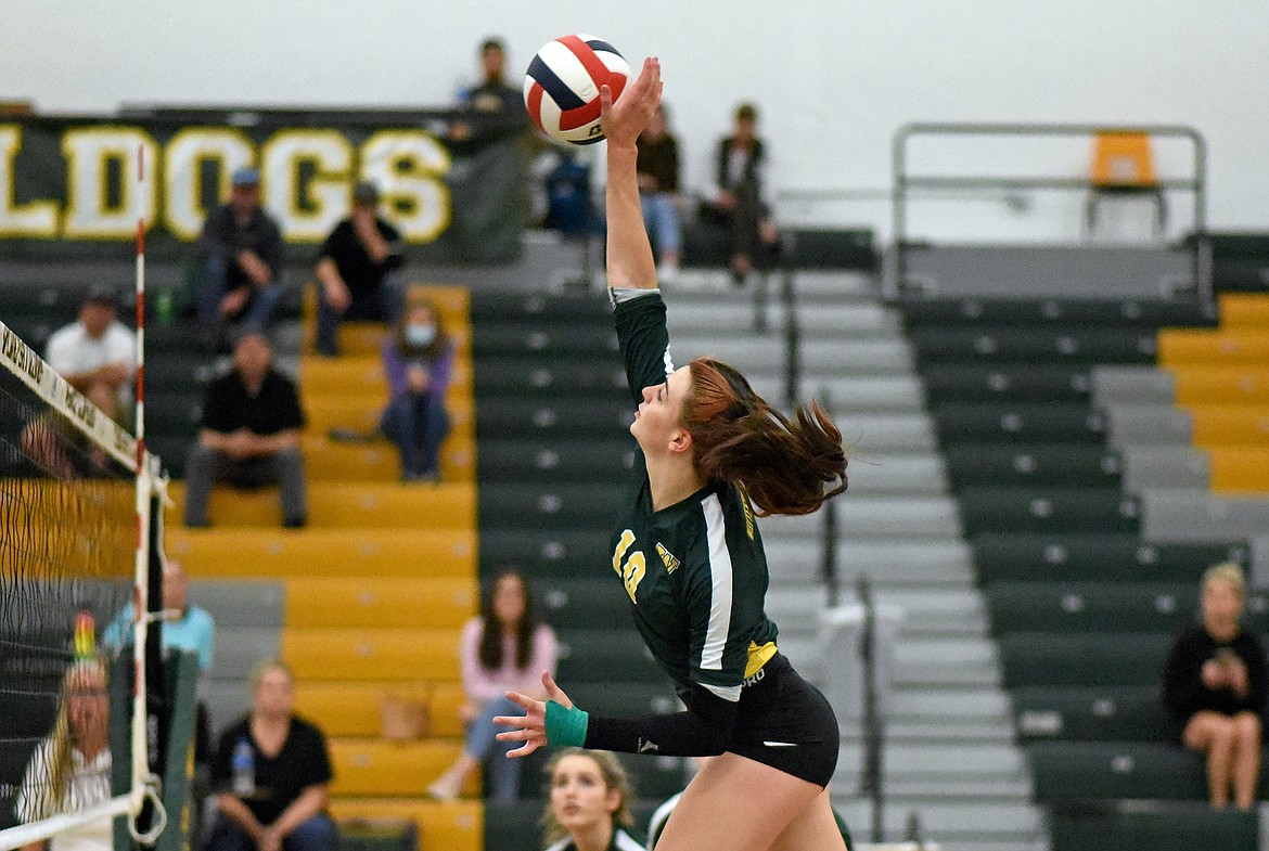 Whitefish senior Jadi Walburn spikes the ball over the net in a match against Polson on Thursday in Whitefish. (Whitney England/Whitefish Pilot)