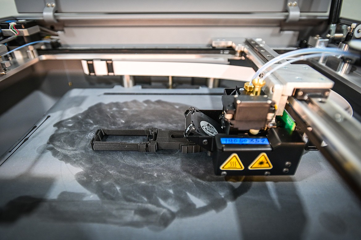 A look inside a Markforged 3D printer while it produces an undisclosed part at SWAE in Columbia Falls on Friday, Sept. 24. (Casey Kreider/Daily Inter Lake)