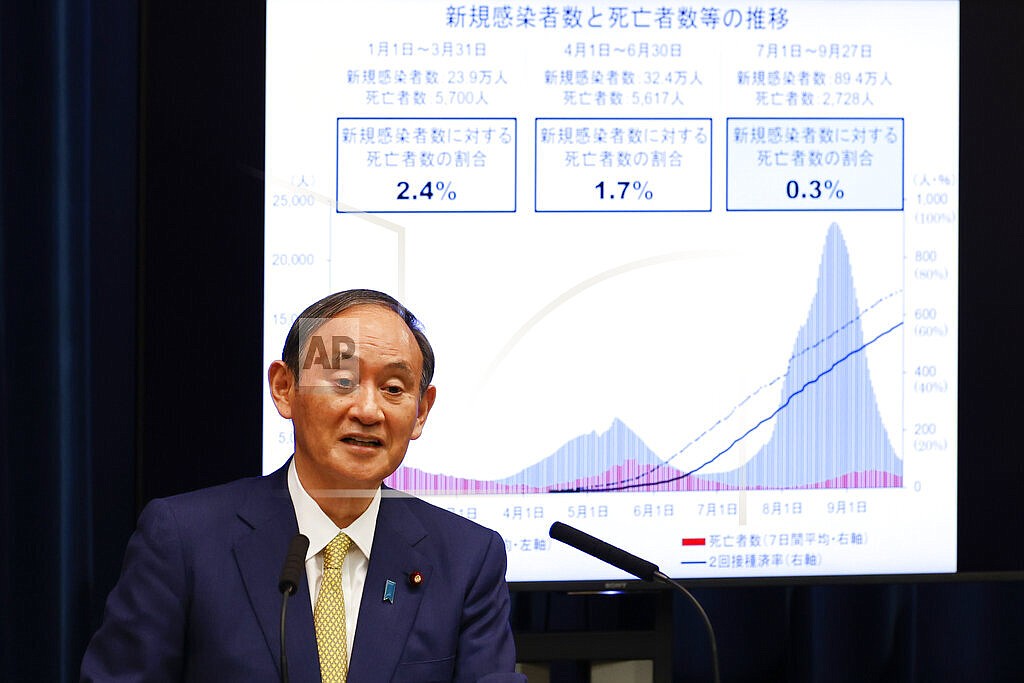 Japan's Prime Minister Yoshihide Suga speaks during a press conference at the prime minister's official residence, Tuesday, Sept. 28, 2021, in Tokyo. Suga announced the coronavirus state of emergency will end Thursday so the economy can be reactivated as infections slow. (Rodrigo Reyes Marin/Pool Photo via AP)