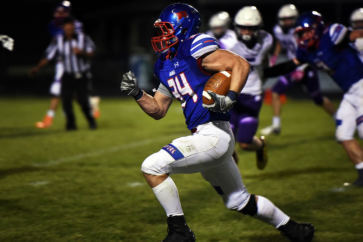 Bigfork running back Joseph Farrier breaks free for a big gain against Whitehall Friday. (Jeremy Weber/Bigfork Eagle)