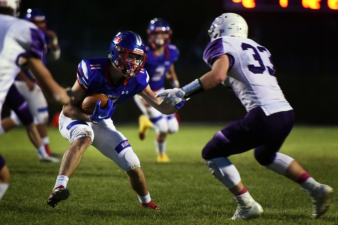 Bigfork's George Bucklin evades Whitehall defenders in the second quarter Friday. (Jeremy Weber/Bigfork Eagle)