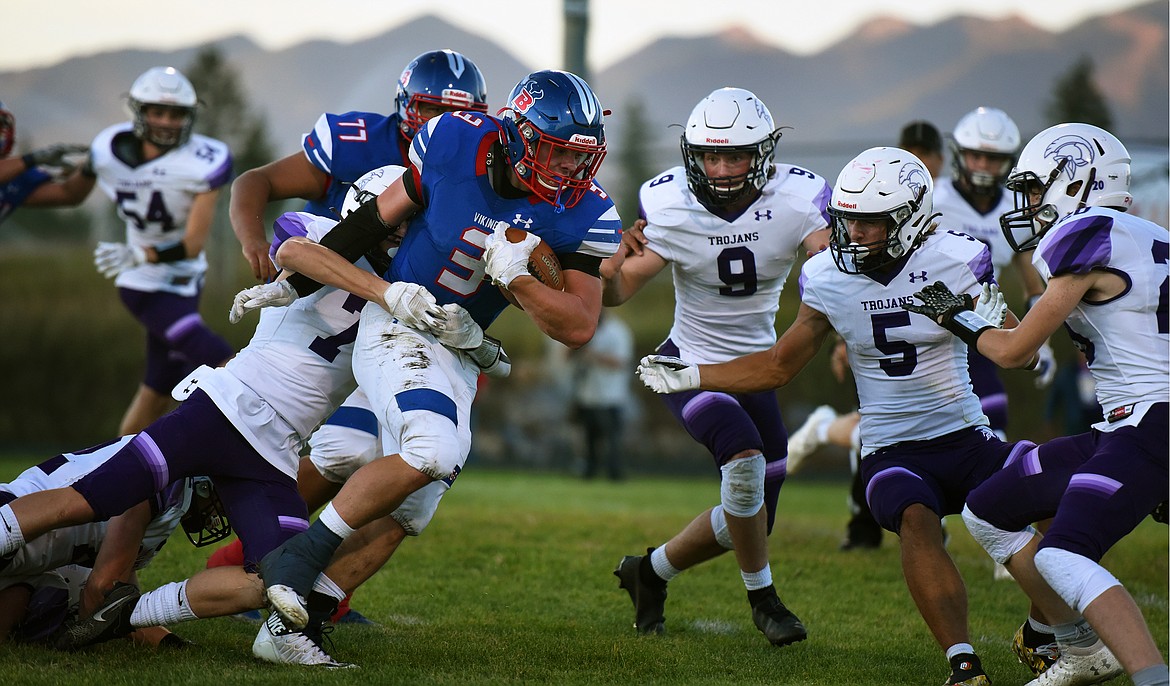 Bigfork running back Levi Taylor breaks away from Whitehall linebacker Michael Reiff in the first quarter of the Vikings' 54-6 victory Friday. (Jeremy Weber/Bigfork Eagle)