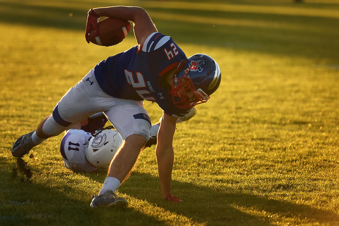 Bigfork wide receiver Dane Hansen keeps his feet after receiving a pass in the first quarter against Whitehall Friday. (Jeremy Weber/Bigfork Eagle)