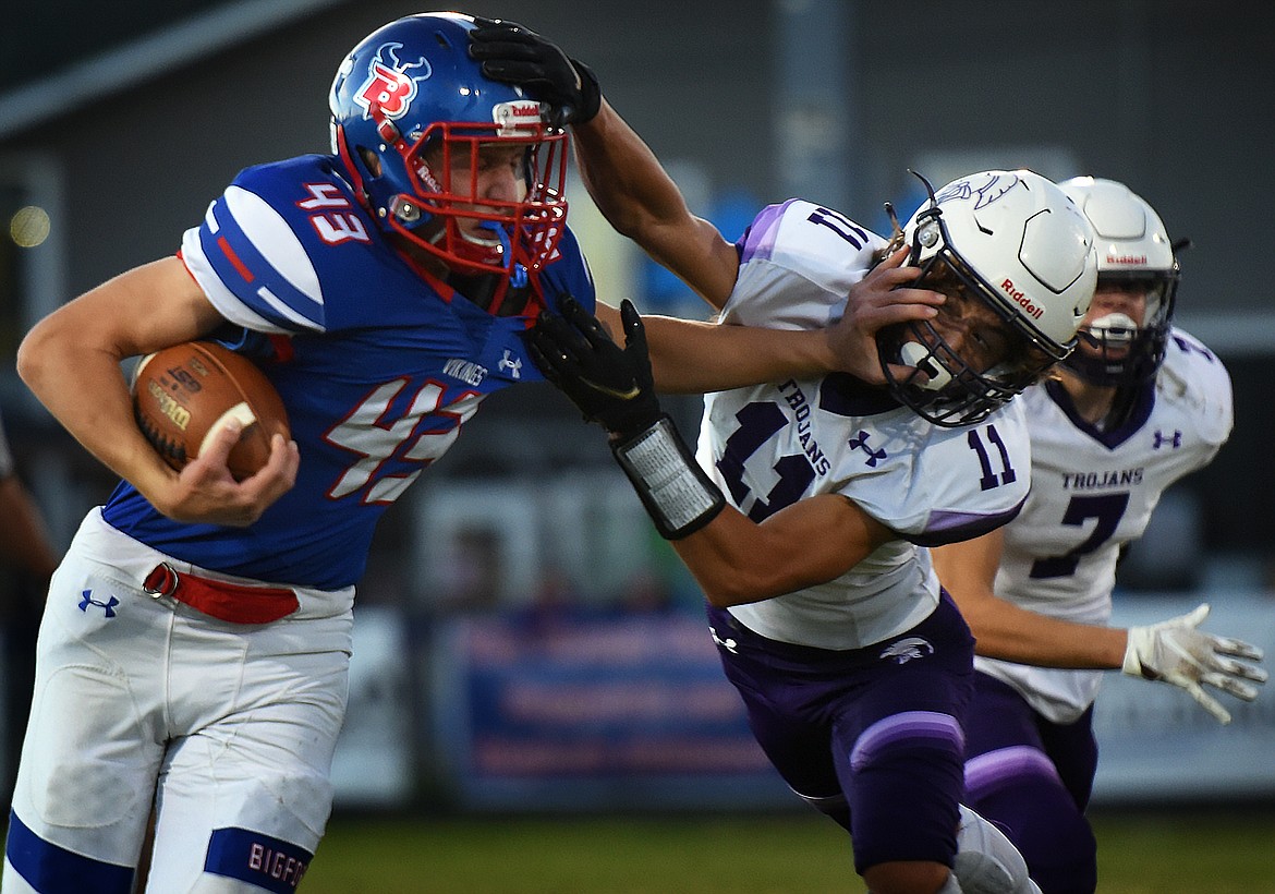 Bigfork running back Wyatt Johnson evades Whitehall defensive back Parker Wagner during the Vikings' 54-6 victory Friday. (Jeremy Weber/Bigfork Eagle)