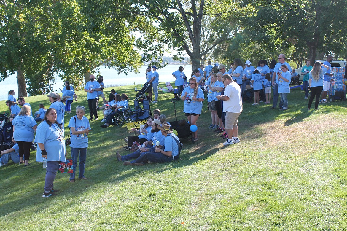 People gather at McCosh Park in preparation for the Buddy Walk Saturday.