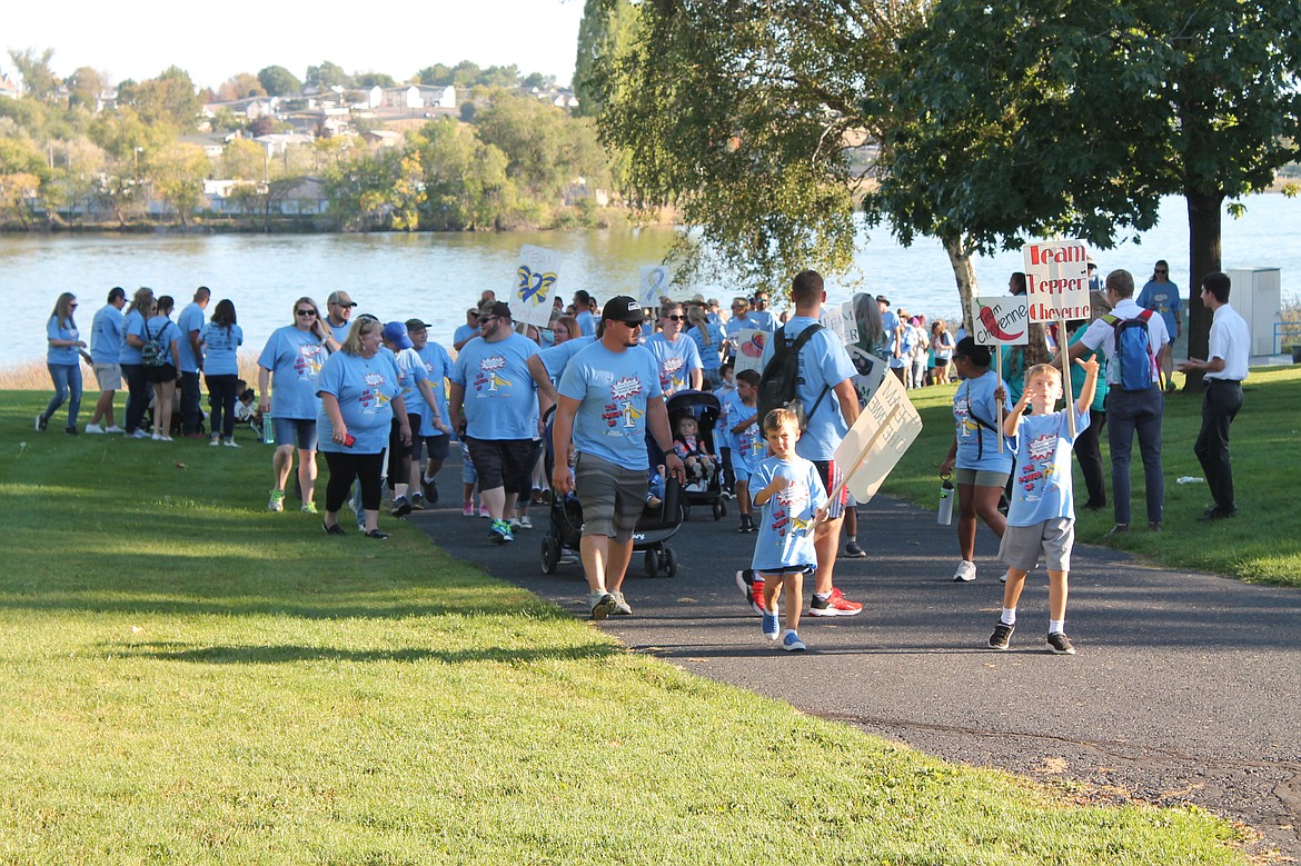 Teams at McCosh Park begin the Down Syndrome Society of Grant County Buddy Walk on Saturday in Moses Lake.