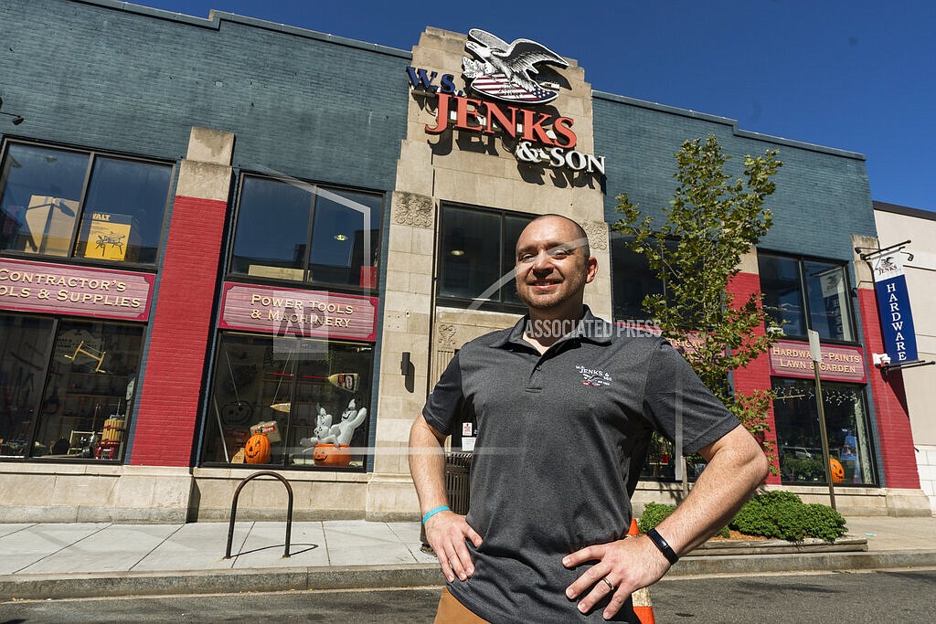 Billy Wommack, purchasing director at the W.S. Jenks & Sons hardware, poses in front of the hardware store, Friday, Sept. 24, 2021, in northeast Washington. The chemical shortages, and a near doubling of oil prices in the past year, mean higher prices for many goods. The W.S. Jenks & Son hardware store is only getting 20% to 30% of paint it needs to meet customer demand without backordering; in normal times the so-called fill rate usually runs 90%. (AP Photo/Manuel Balce Ceneta)