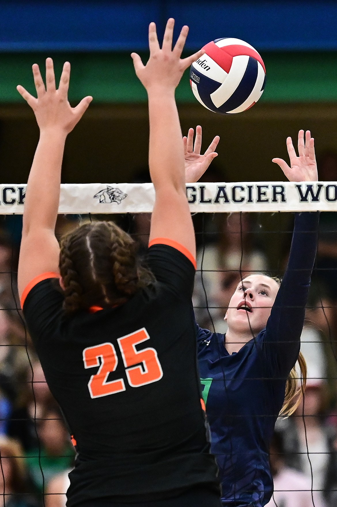 Glacier's Sarah Downs (9) goes up for a kill against Flathead's Maddy Moy (18) and Savanna Sterck (25) at Glacier High School on Thursday, Sept. 30. (Casey Kreider/Daily Inter Lake)