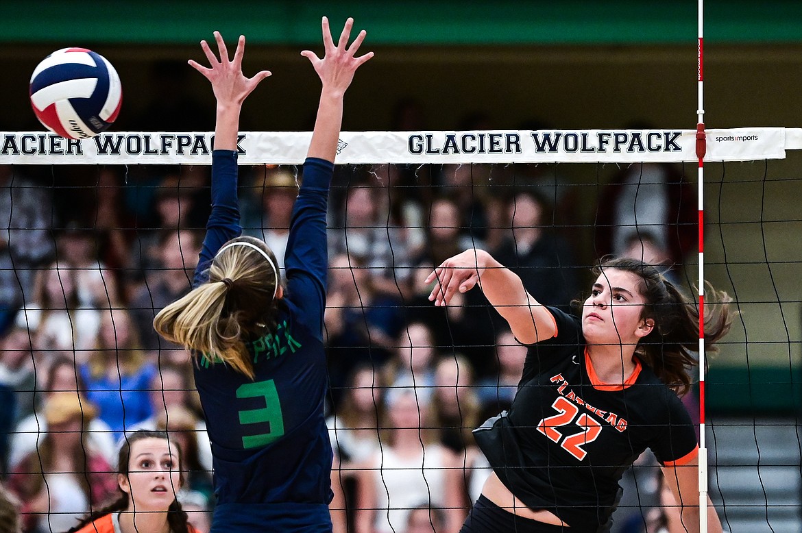 Flathead's Sienna Sterck (22) goes up for a kill against Glacier's Haven Speer (3) at Glacier High School on Thursday, Sept. 30. (Casey Kreider/Daily Inter Lake)