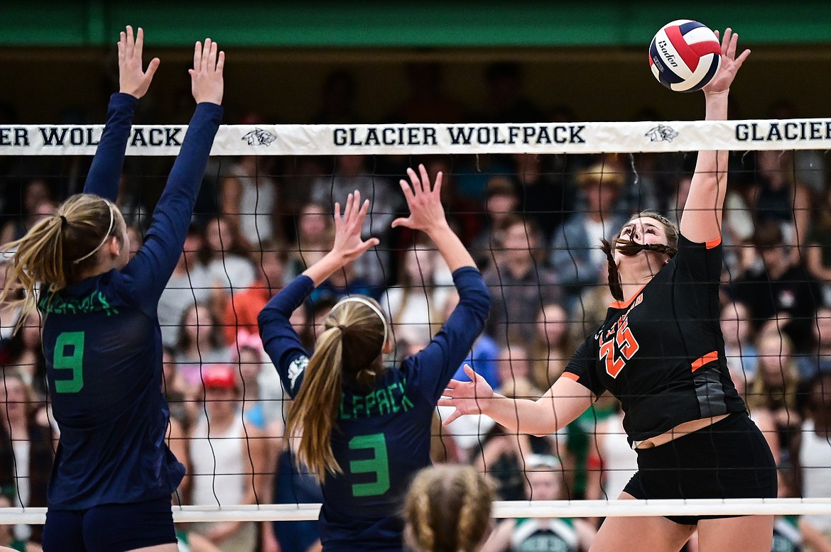 Flathead's Alliyah Stevens (25) goes up for a kill against Glacier's Sarah Downs (9) and Haven Speer (3) at Glacier High School on Thursday, Sept. 30. (Casey Kreider/Daily Inter Lake)