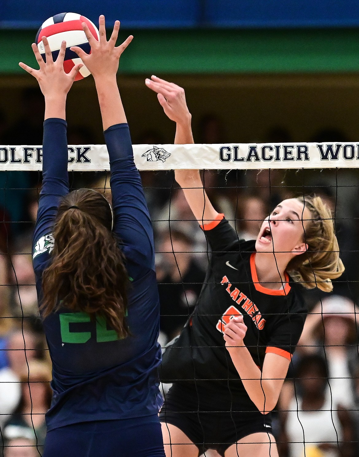 Flathead's Kennedy Moore (9) goes up for a kill against Glacier's Madeline Davis (22) at Glacier High School on Thursday, Sept. 30. (Casey Kreider/Daily Inter Lake)