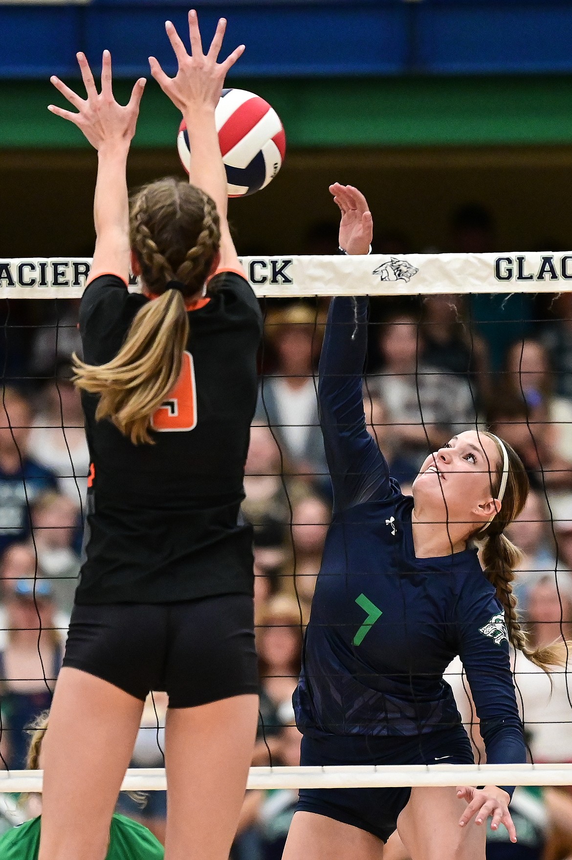 Glacier's Sammie Labrum (7) goes up for a kill against Flathead's Kennedy Moore (9) at Glacier High School on Thursday, Sept. 30. (Casey Kreider/Daily Inter Lake)