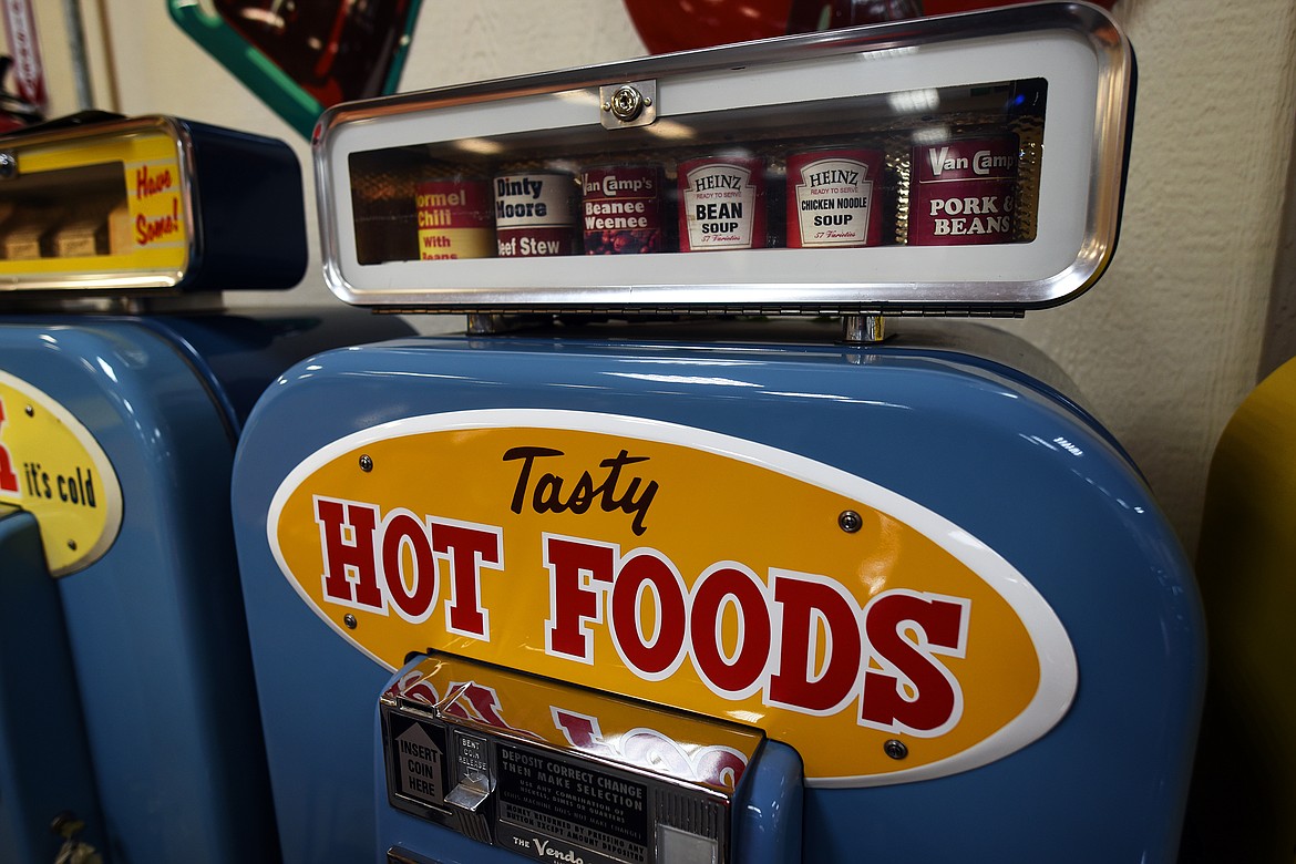 A unique piece in the collection of Bob King and Colten Hart, a vending machine that dispenses hot canned foods. (Jeremy Weber/Daily Inter Lake)