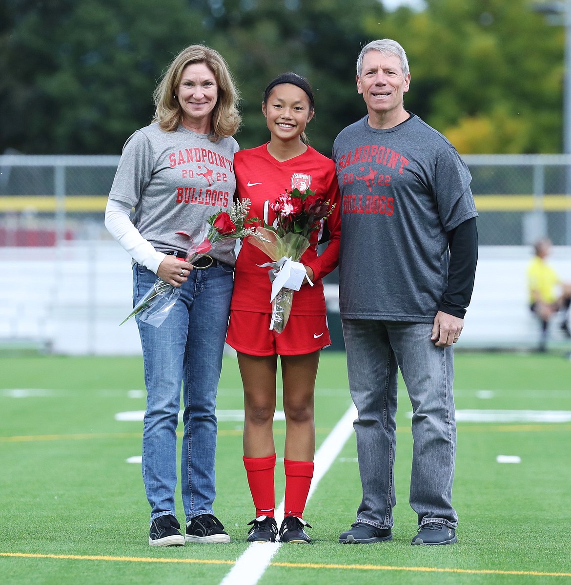 Ava Mazzilli poses for a photo with her family on Senior Night.