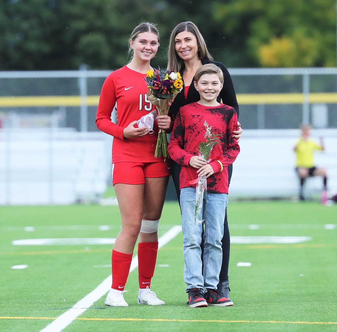 Averie Brewer poses for a photo with her family on Senior Night.