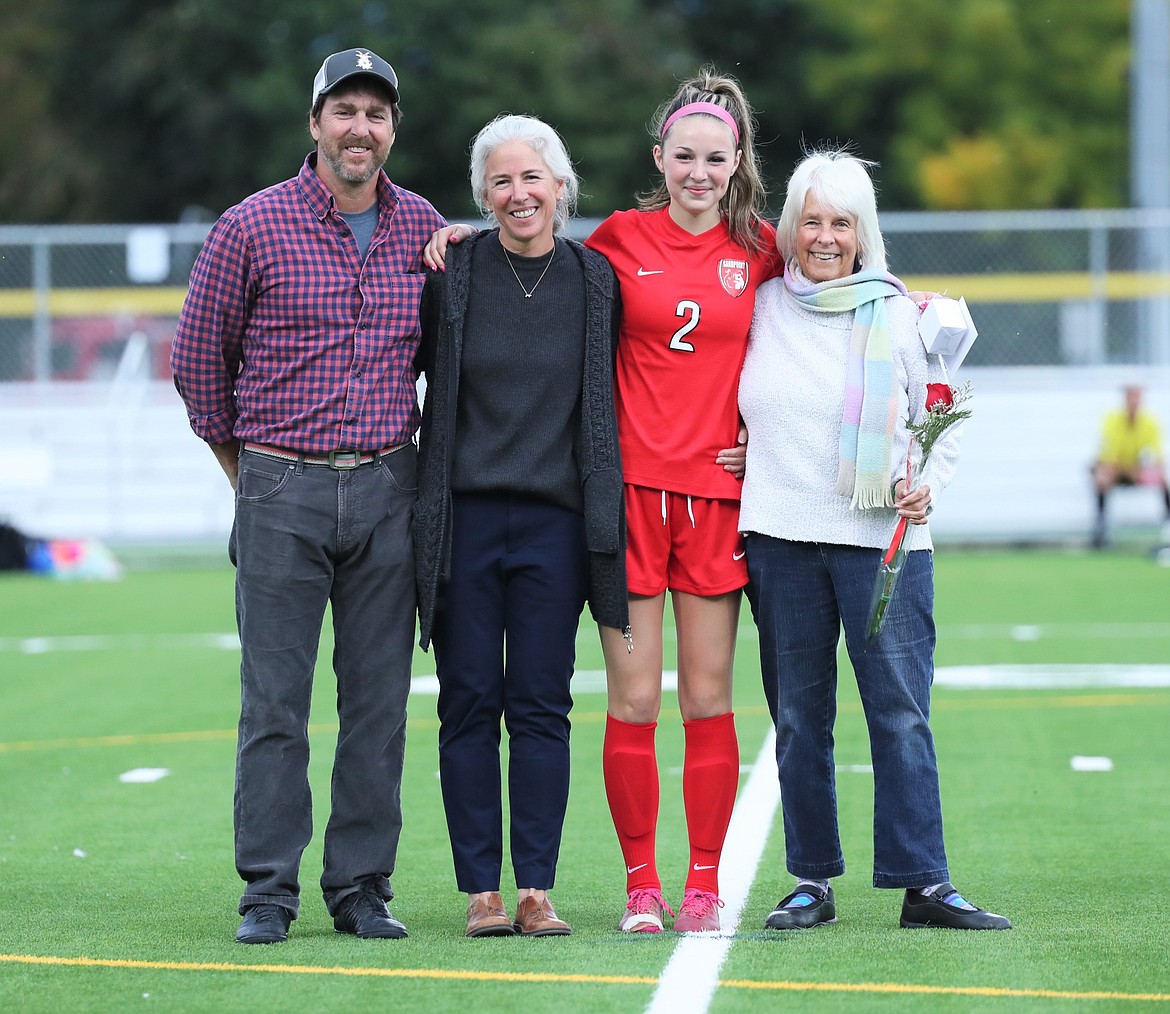 Erin Eddy poses for a photo with her family on Senior Night.